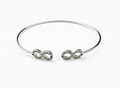 Pulsera Abierta Infinito en Plata .925 con Detalle de Zafiro
